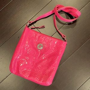 Bright pink Tommy Hilfiger purse.